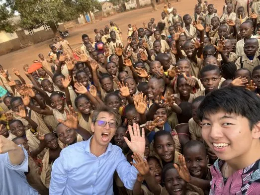 Akira Watanabe with students during community work