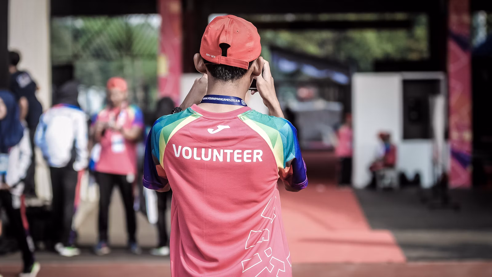 Volunteer photographing a community event